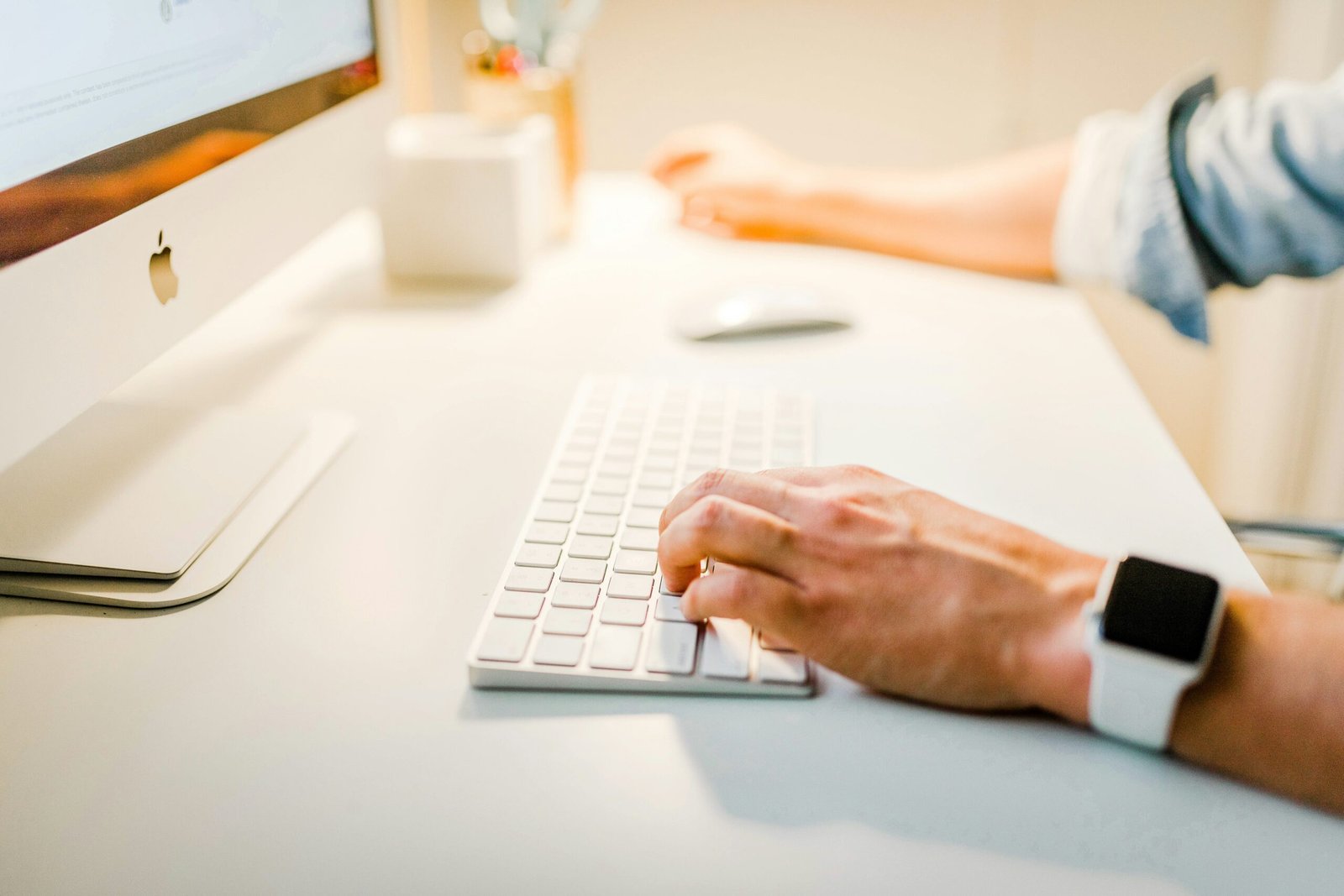 person using iMac